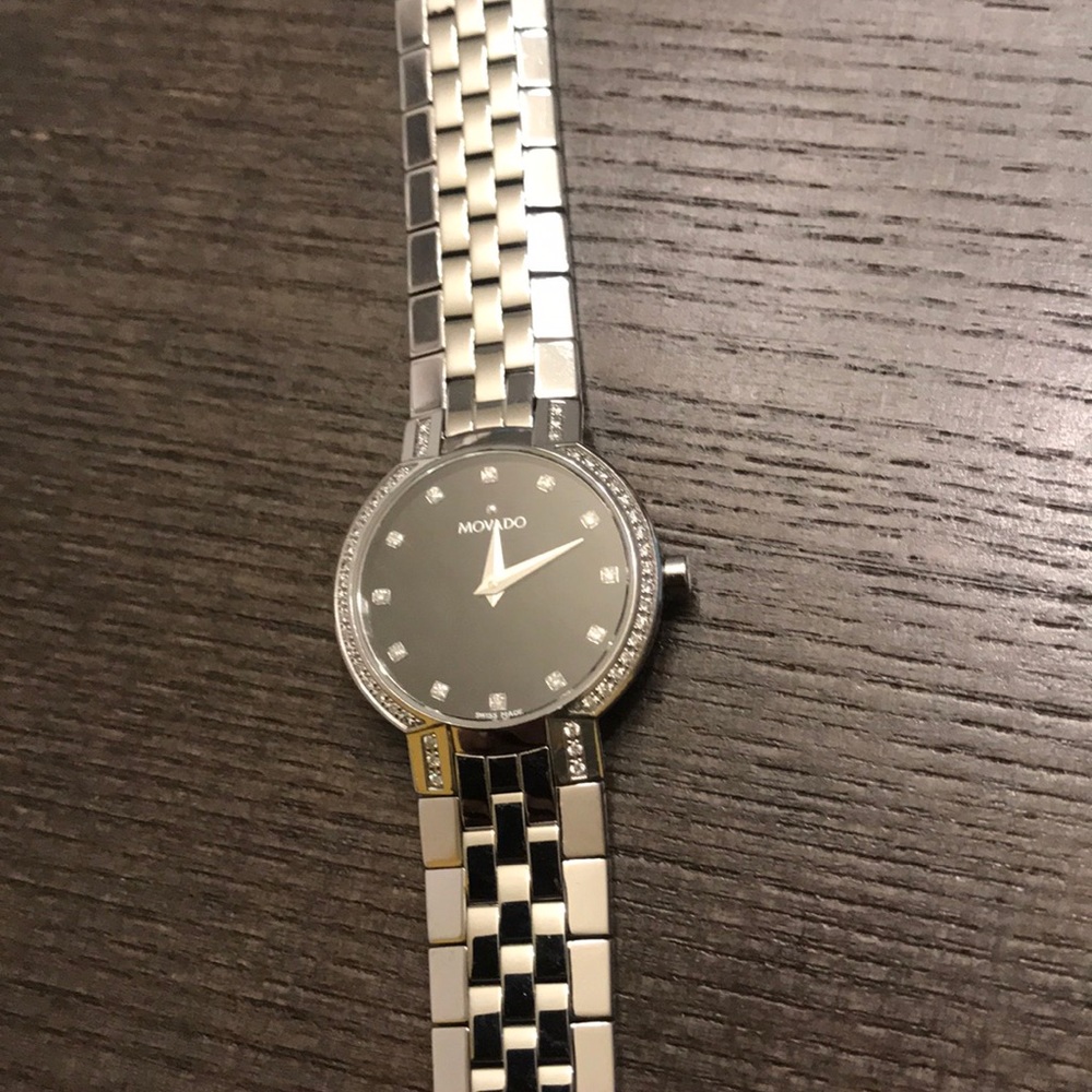 Brand new matching his and hers Movado watches